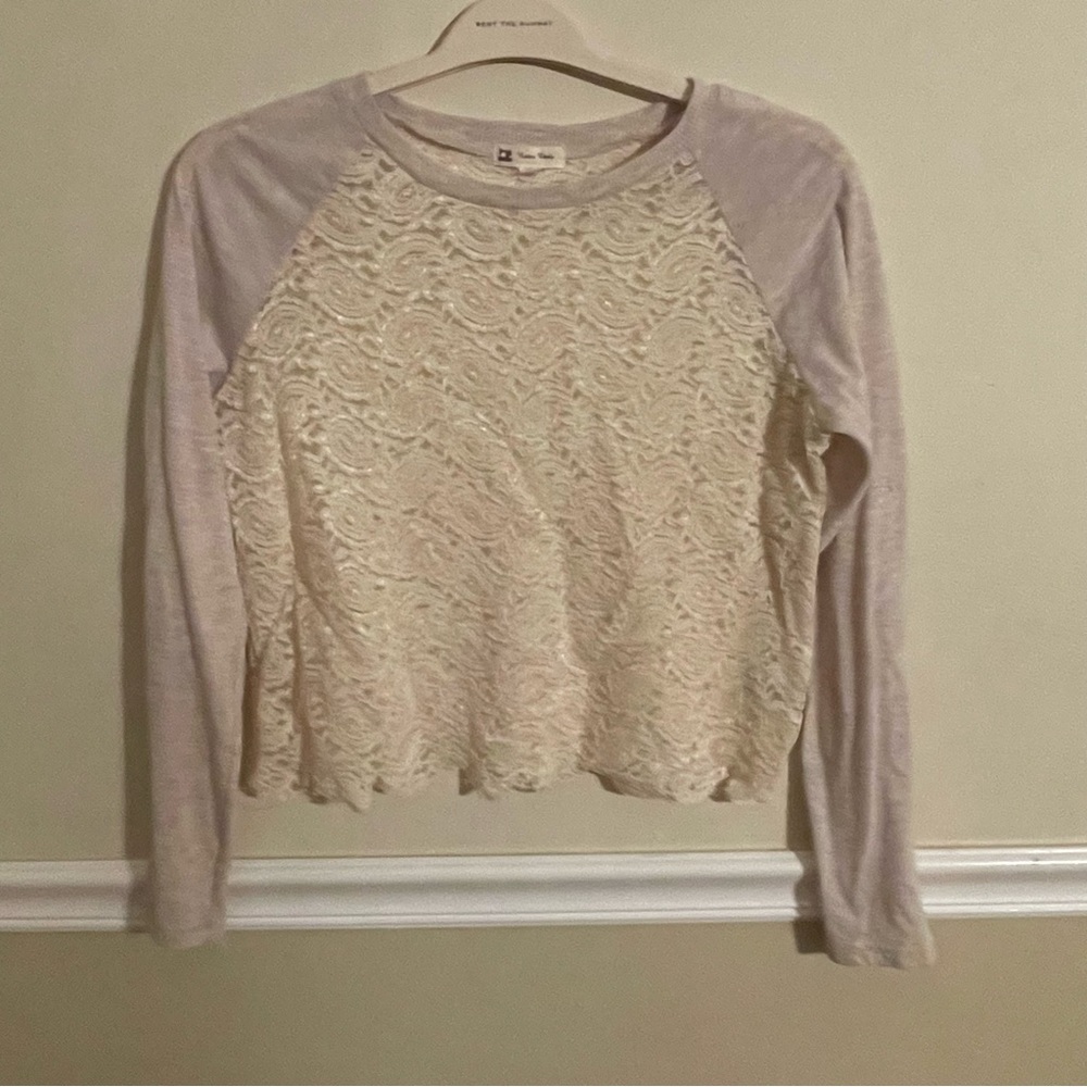 Cute lace top, worn twice, in excellent condition. Size medium.